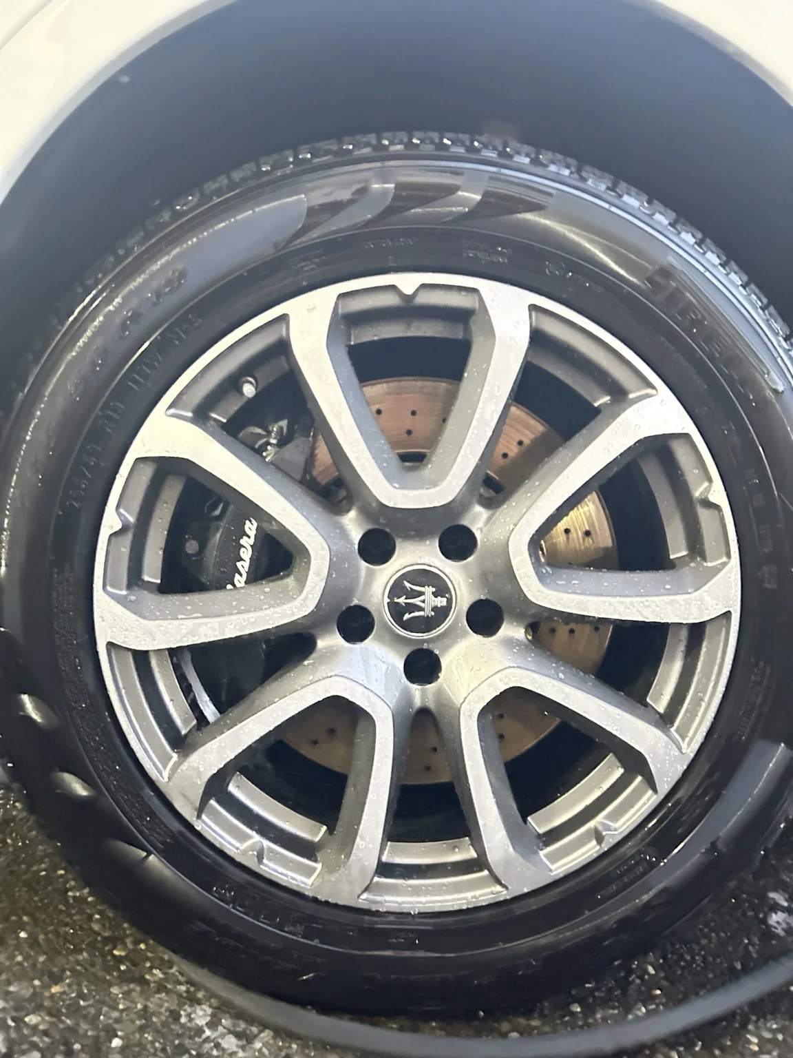 The rinsed Maserati wheel after cleaning